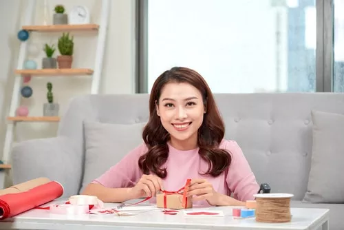 Woman wrapping gifts